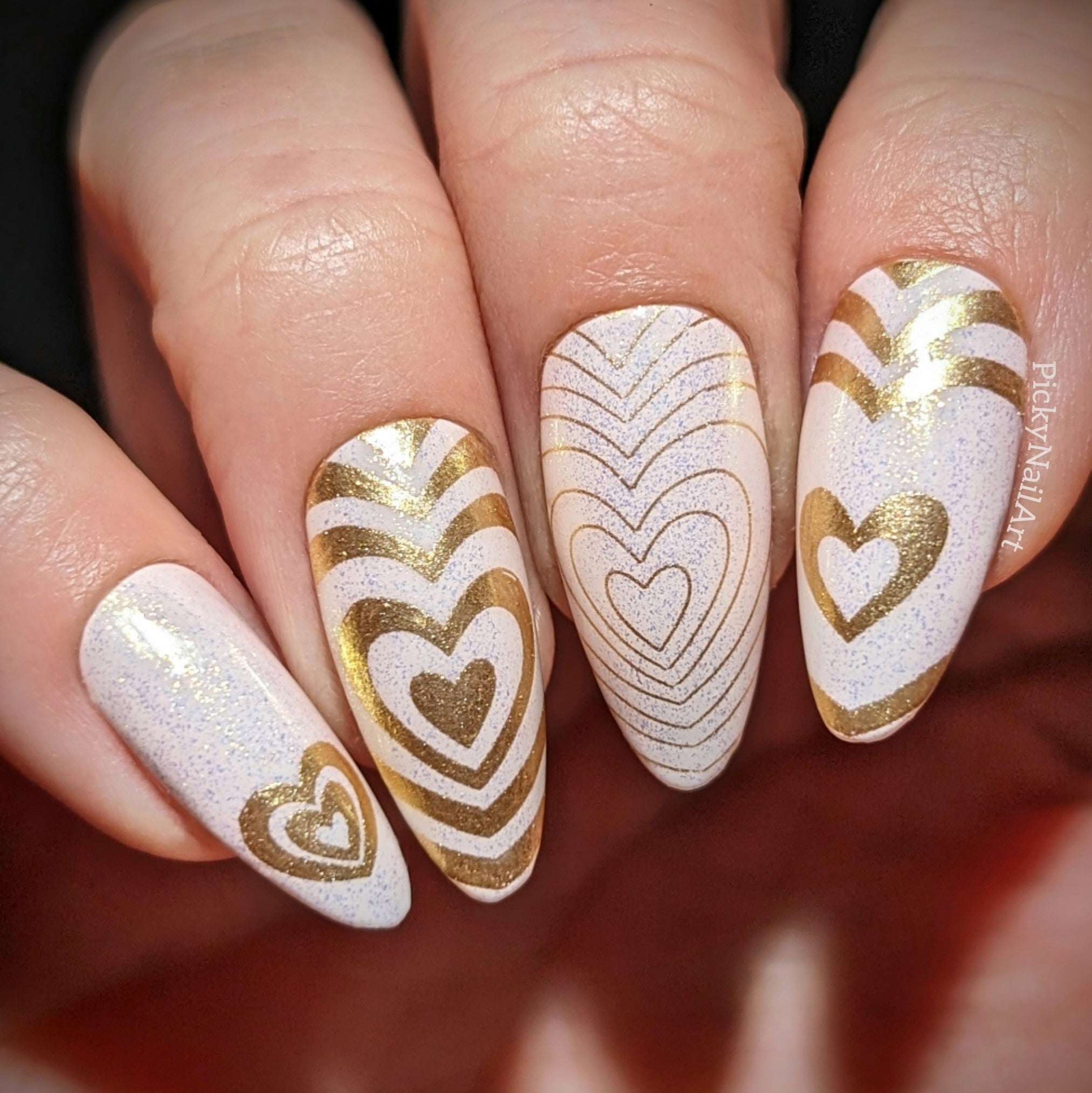 manicured-hand-with-stunning-valentines-nail-art-design-of-hearts