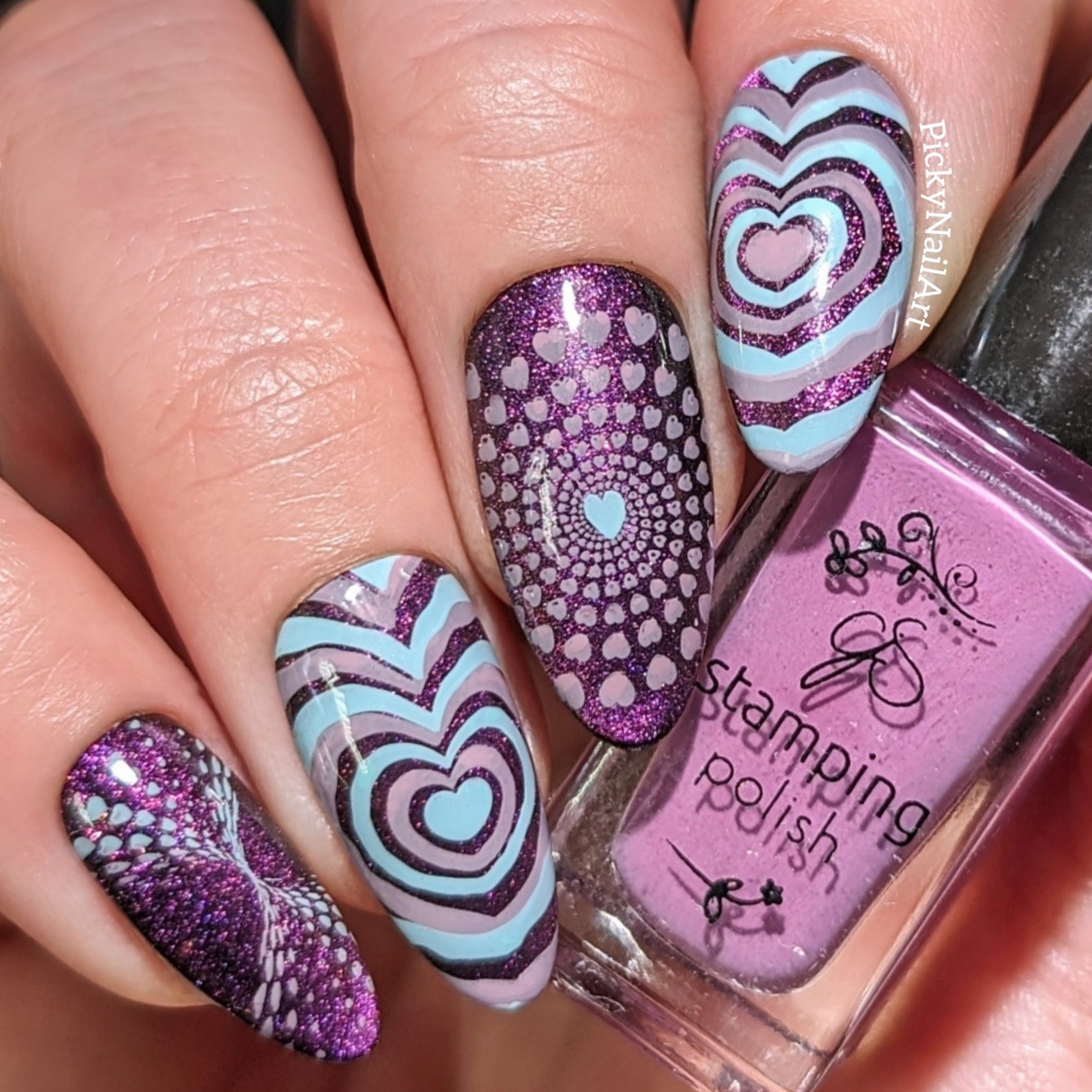 manicured-hand-with-stunning-valentines-nail-art-designs-of-hearts-in-different-patterns-and-sizes