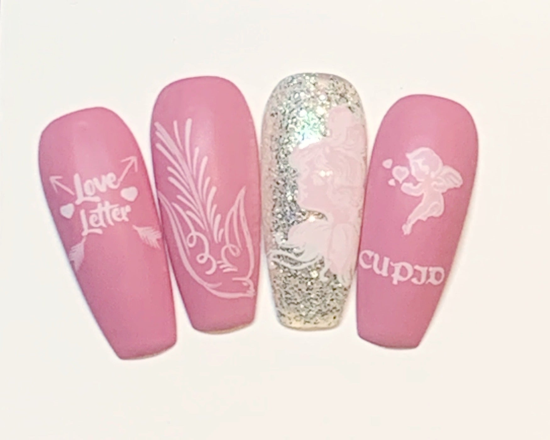 set-of-nail-tips-showing-valentines-themed-nail-art-designs-of-cupid-and-a-dove