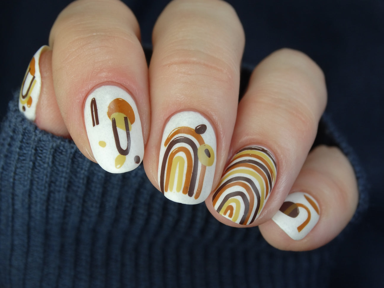 stunning-manicure-with-nail-art-designs-of-boho-arches-and-shapes