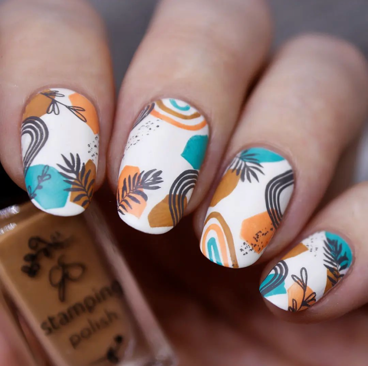 stunning-manicure-with-nail-art-designs-of-abstract-shapes-boho-arches-and-leaves