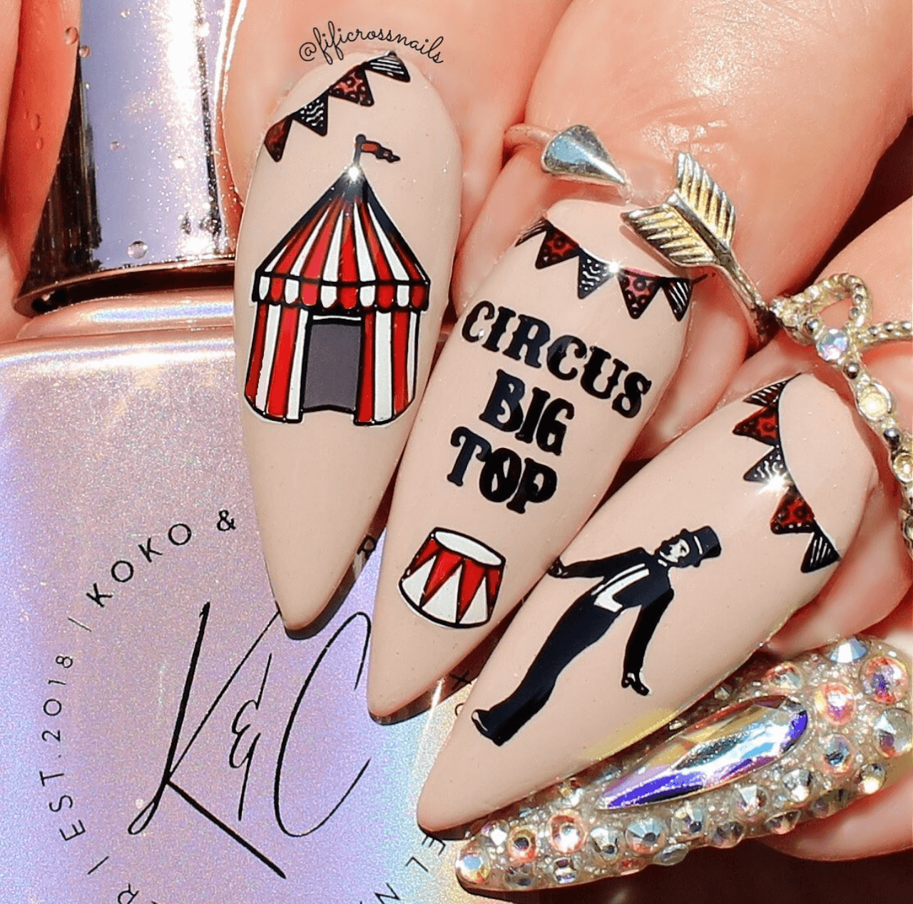 Manicure-with-nail-art-designs-of-a-circus-tent-bunting-and-a-ringmaster-the-words-circus-big-top