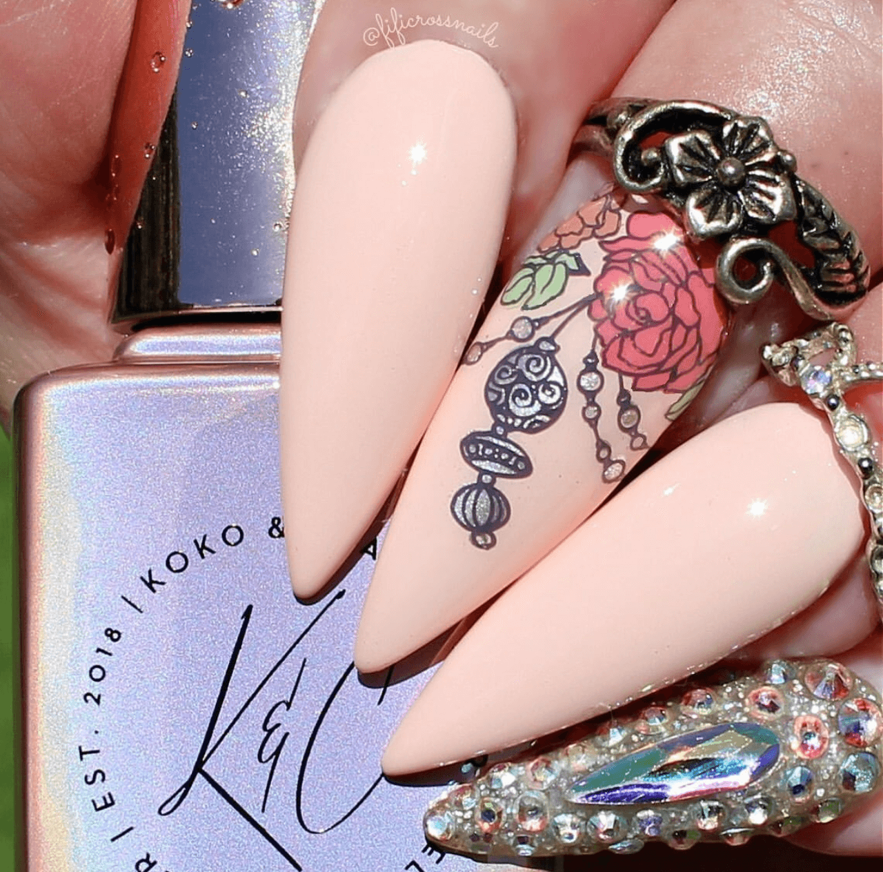 beautiful-floral-manicure-with-nail-art-design-of-a-rose-with-tassels