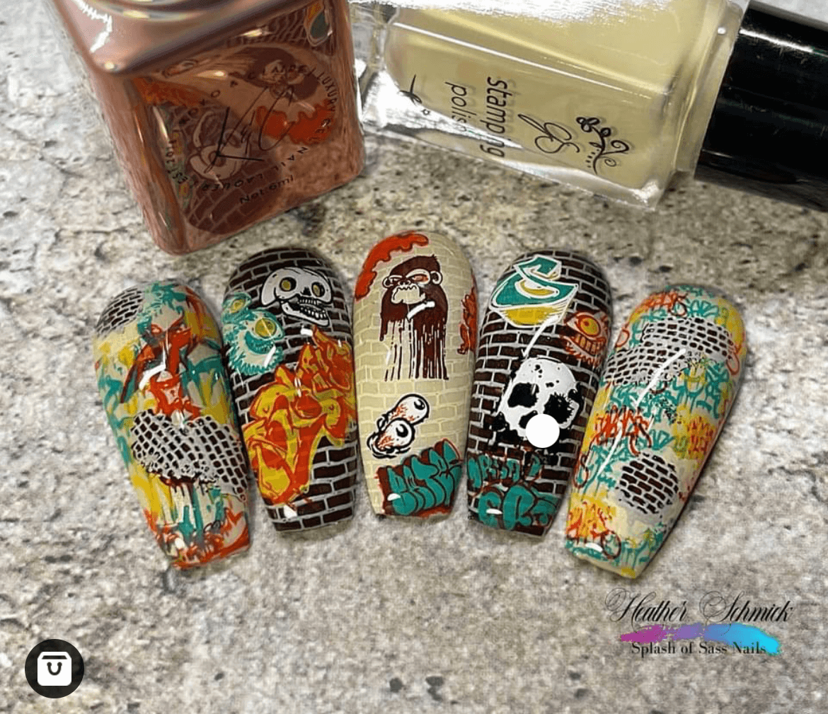 set-of-nail-tips-with-graffiti-style-nail-art-designs-of-brick-walls-and-spray-painted-images