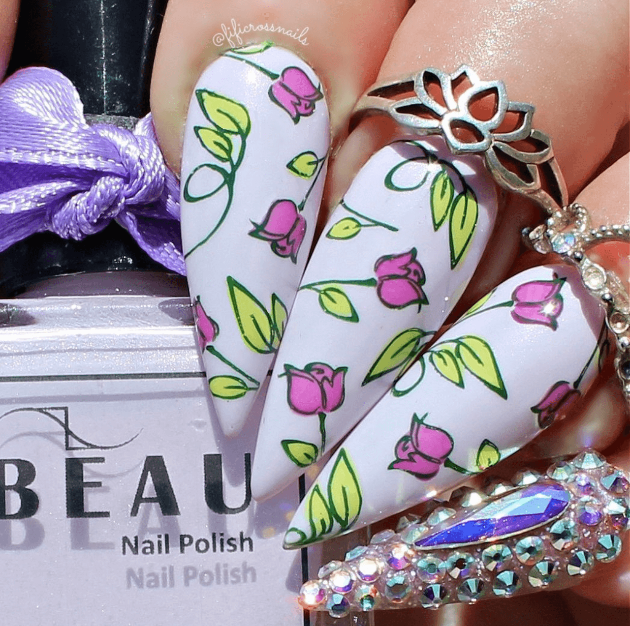 stunning-manicure-showing-nail-art-designs-of-tulips-and-leaves