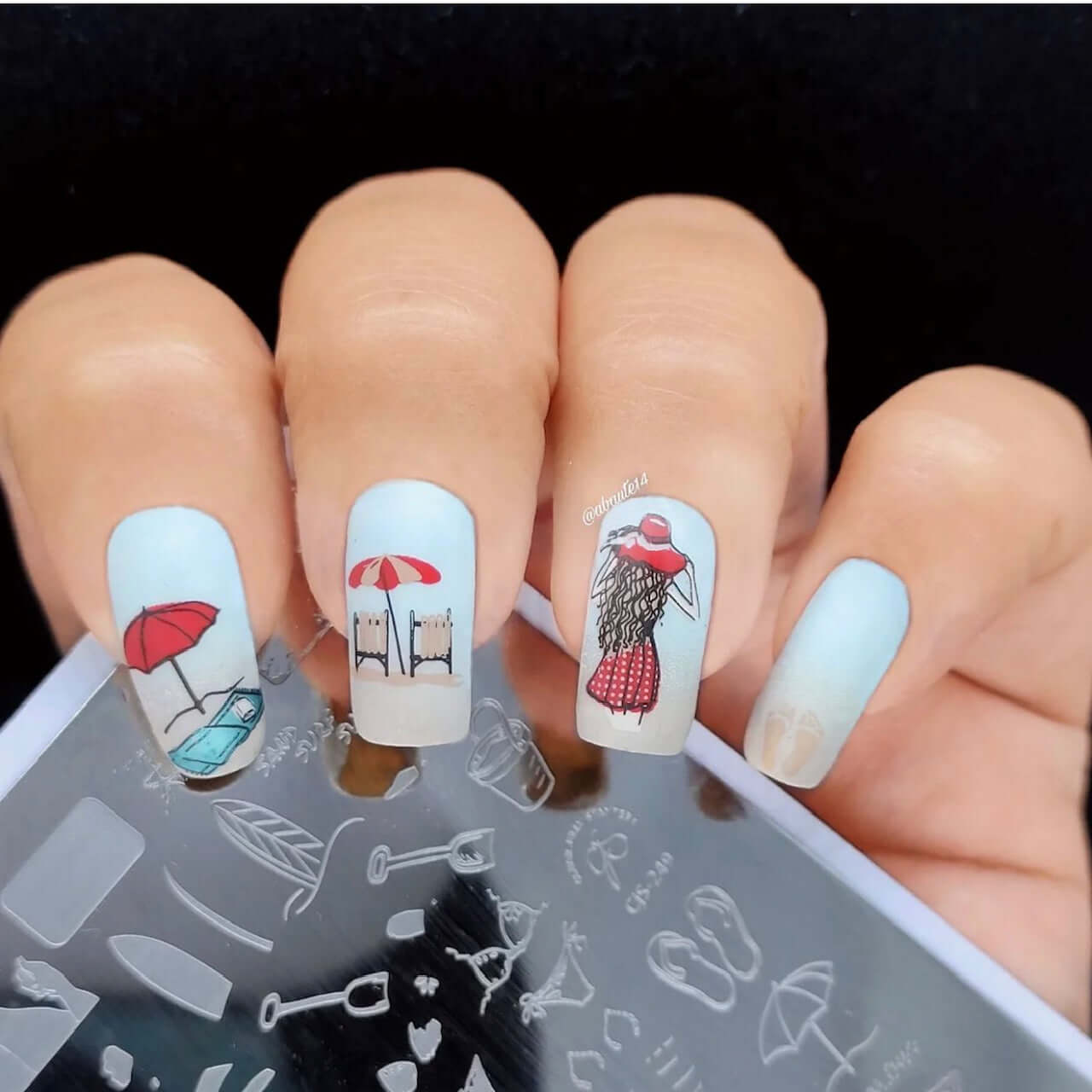 stunning-manicure-with-nail-art-designs-of-a-girl-in-a-sundress-with-beach-chairs-and-umbrellas