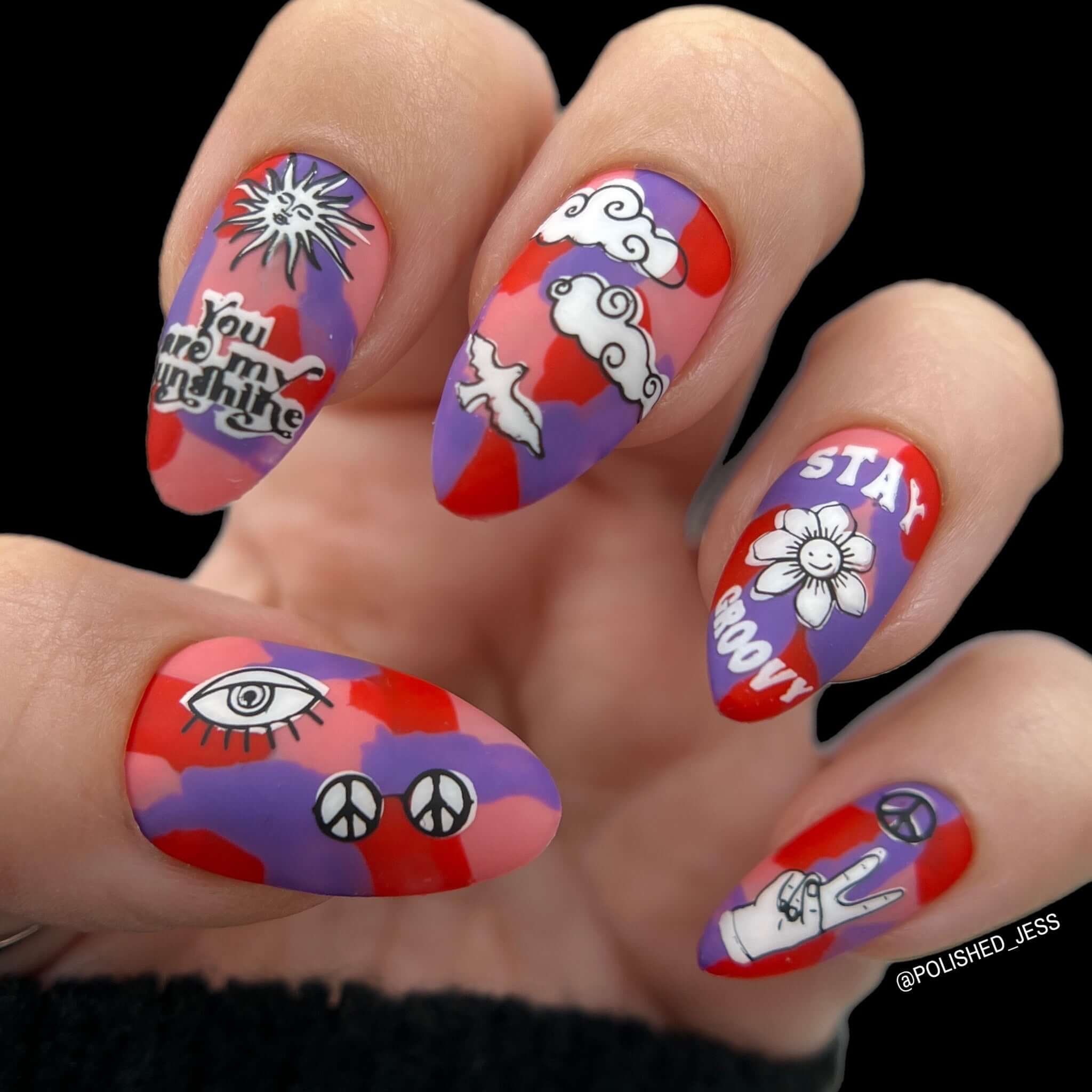 manicure-with-retro-nail-art-designs-of-clouds-peace-sign-flowers-and-the-words-stay-groovy