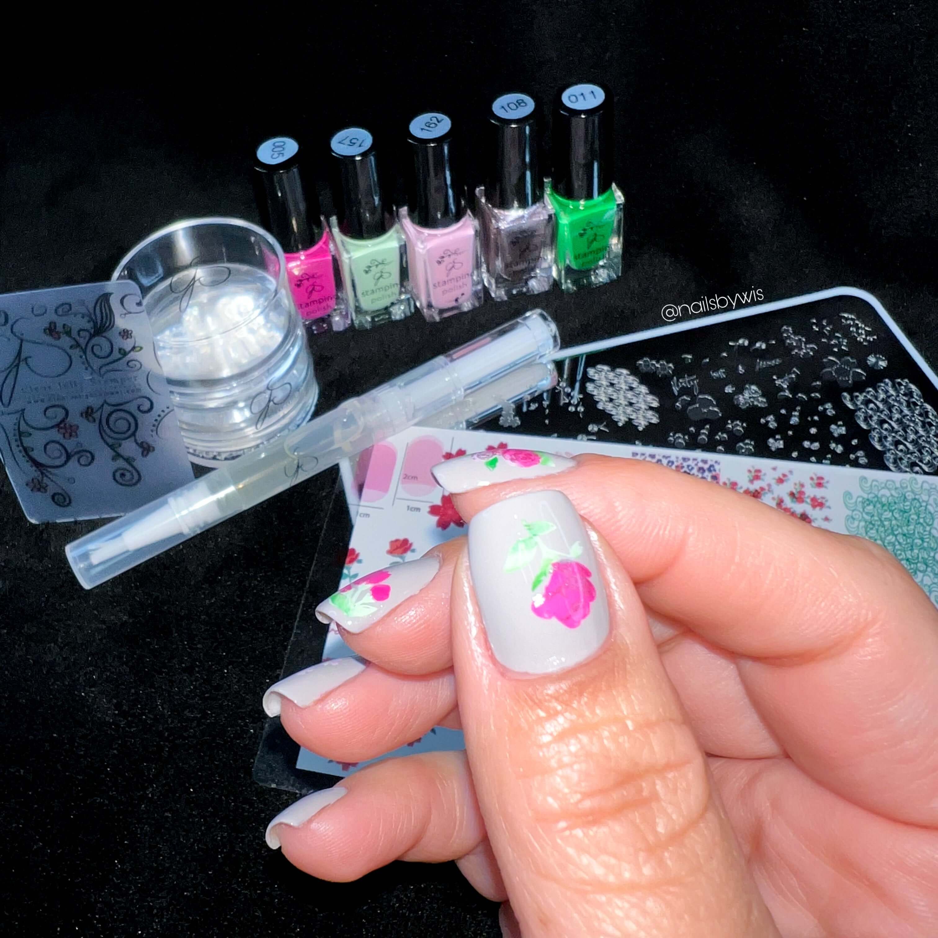 nail-art-stamping-supplies-with-a-manicure-showing-roses