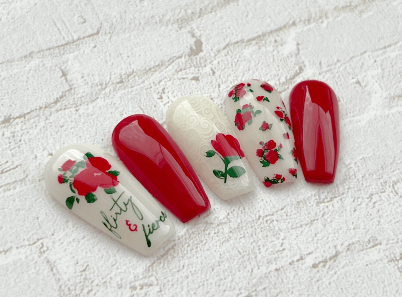 set-of-nail-tips-with-nail-art-designs-of-roses-flirty-and-fierce