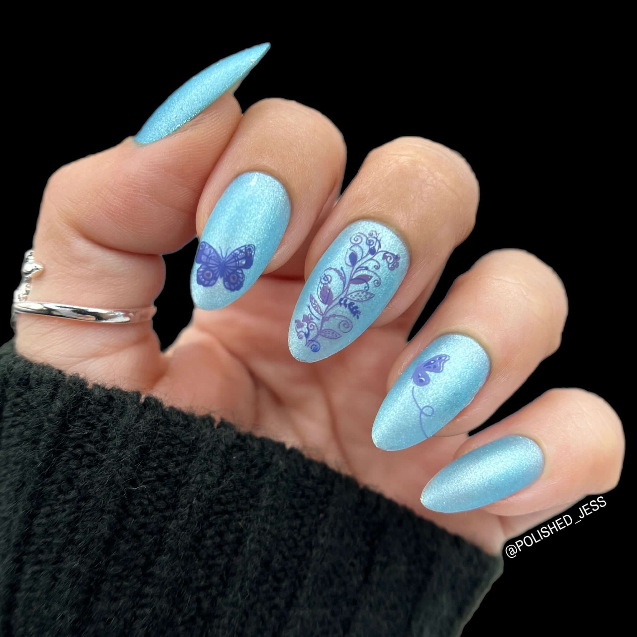 beautiful-shimmery-manicure-with-nail-art-designs-of-a-butterfly-and-a-vine-of-leaves