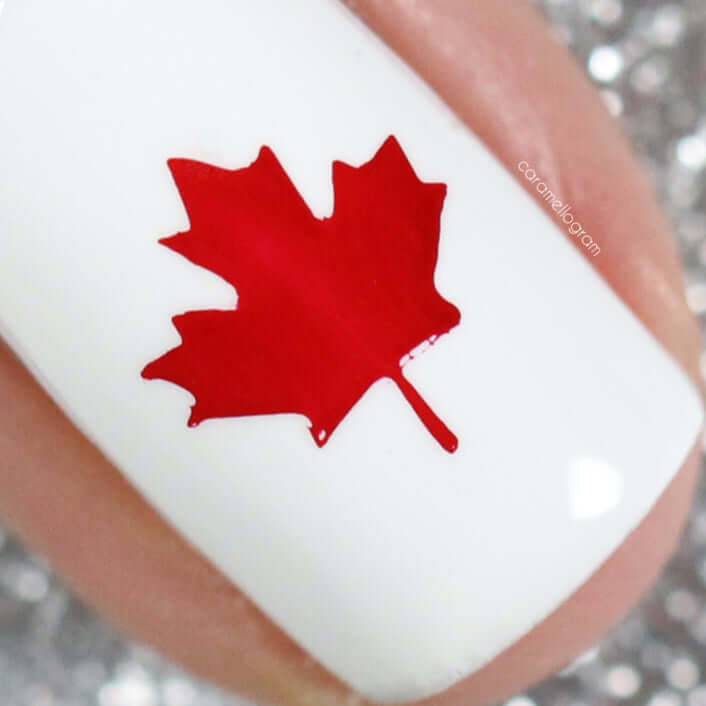 single-manicured-nail-showing-a-maple-leave-in-nail-art