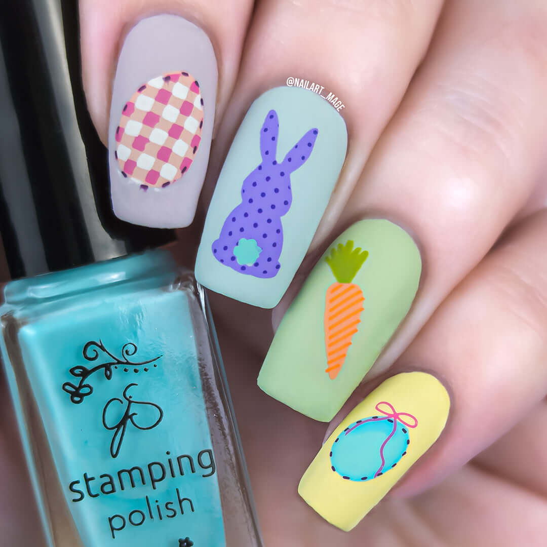 beautiful-easter-manicure-with-nail-art-designs-of-a-patterned-rabbit-carrot-and-easter-eggs