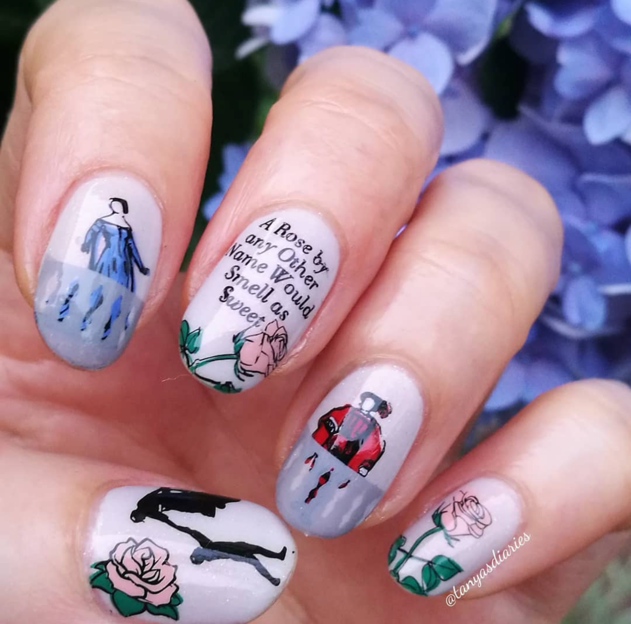 manicure-showing-nail-art-designs-of-roses-romeo-juliet-and-words