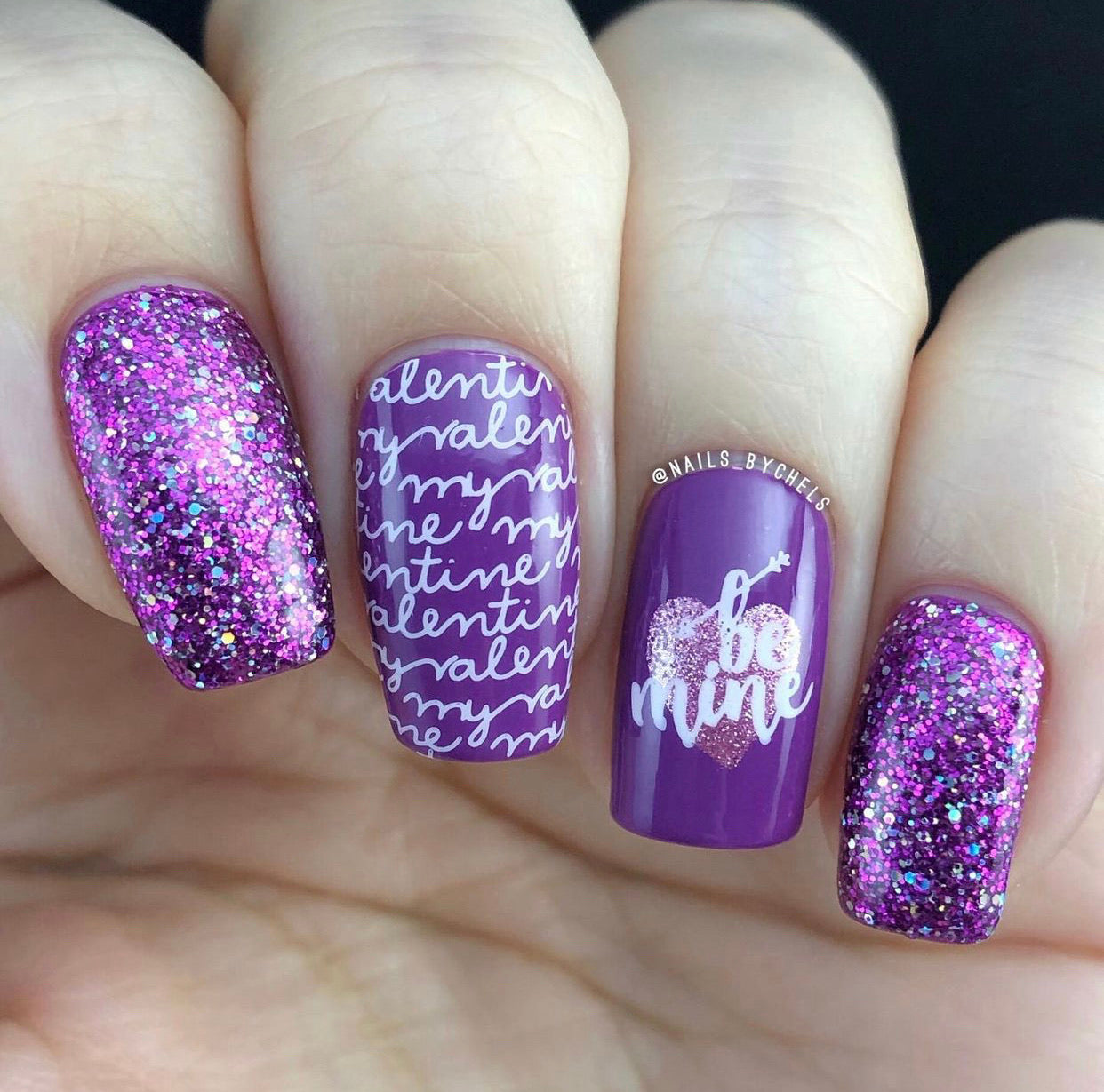 bright-manicure-with-nail-art-designs-of-a-heart-and-the-words-be-mine