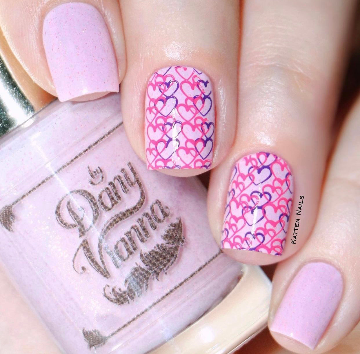 stunning-manicure-with-full-coverage-overlapping-heart-pattern-in-nail-art