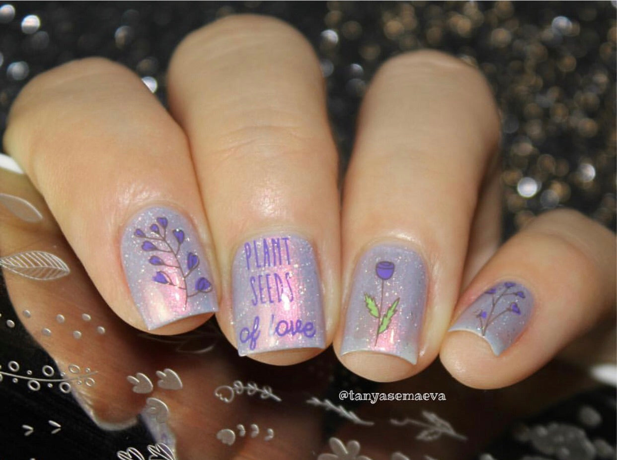 manicure-with-shimmery-nail-art-designs-of-leaves-and-flowers-and-the-words-plant-seeds-of-love